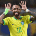 Neymar é convocado por Ancelotti e disputará sua quarta Copa do Mundo com o Brasil - ThingsOut Brazilian soccer player wearing a yellow Brazil jersey with number 10, hands to ears, tongue out in celebration.