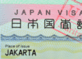 Close-up of a Japan visa showing the text JAPAN VISA and Place of issue Jakarta on a colorful background.