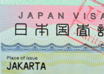 Close-up of a Japan visa showing the text JAPAN VISA and Place of issue Jakarta on a colorful background.