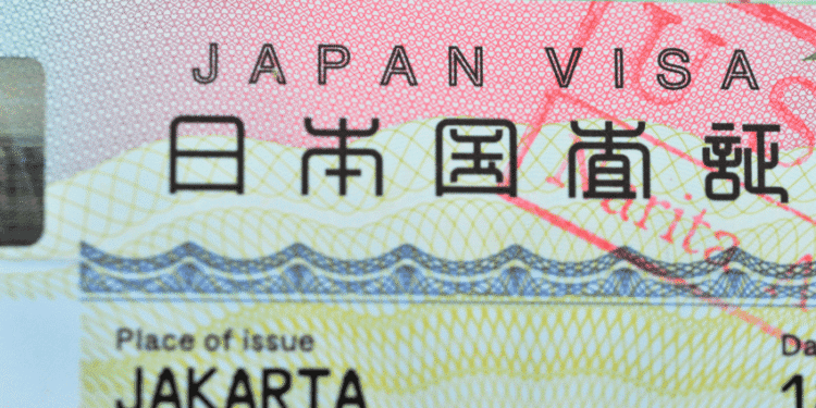 Close-up of a Japan visa showing the text JAPAN VISA and Place of issue Jakarta on a colorful background.