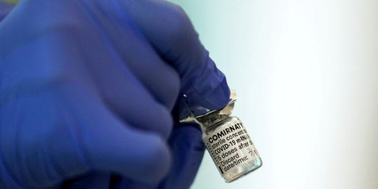 A medical worker holds a vial of the Pfizer-BioNTech coronavirus disease (COVID-19) vaccine at Tokyo Medical Center as Japan launches its inoculation campaign