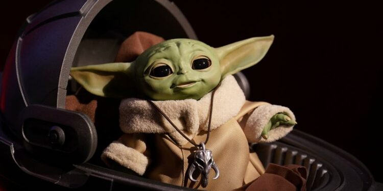 FILE PHOTO: An animatronic Baby Yoda toy is pictured  during a "Star Wars" advance product showcase in the Manhattan borough of New York City