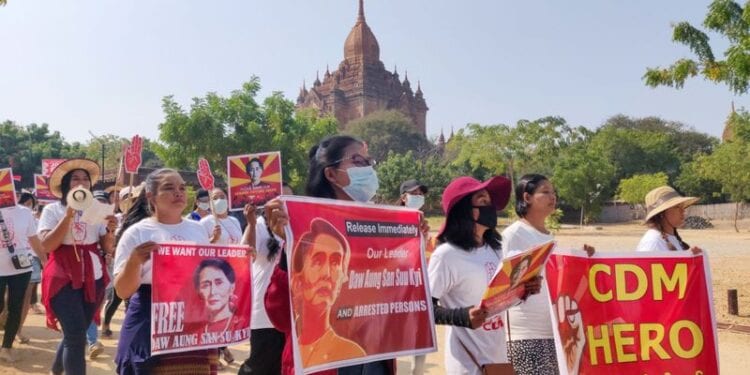 Demonstrators march during a protest against the military coup, near temples in Bagan